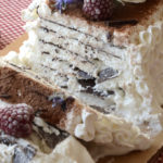 A homemade Vienetta ice cream has ben sliced, revealing crispy thin layers of chocolate in the ice cream cake